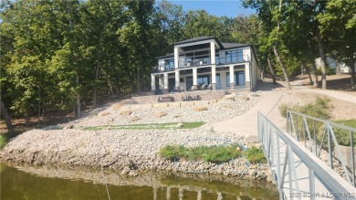 2023 construction, stunning home and is TURNKEY! Stucco & stone on The Club At Porto Cima in Missouri - for sale on GolfHomes.com, golf home, golf lot