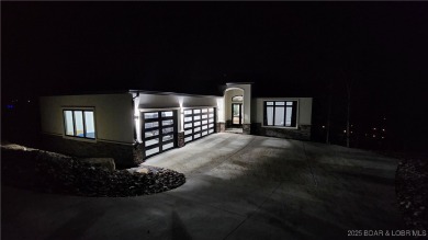 2023 construction, stunning home and is TURNKEY! Stucco & stone on The Club At Porto Cima in Missouri - for sale on GolfHomes.com, golf home, golf lot
