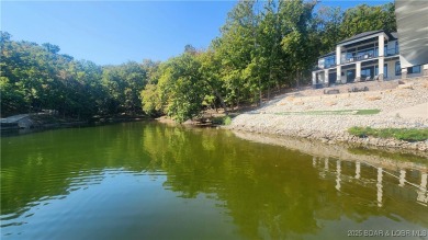 2023 construction, stunning home and is TURNKEY! Stucco & stone on The Club At Porto Cima in Missouri - for sale on GolfHomes.com, golf home, golf lot