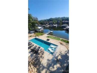 2023 construction, stunning home and is TURNKEY! Stucco & stone on The Club At Porto Cima in Missouri - for sale on GolfHomes.com, golf home, golf lot