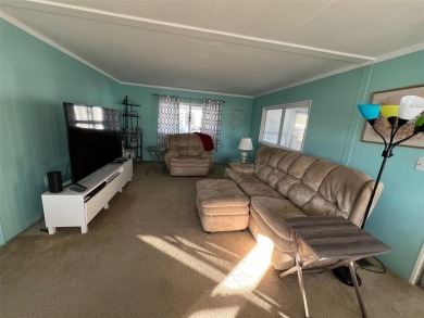 Delight in this nicely appointed two-bedroom, two-bathroom on Palm Hill Golf Club in Florida - for sale on GolfHomes.com, golf home, golf lot