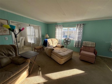 Delight in this nicely appointed two-bedroom, two-bathroom on Palm Hill Golf Club in Florida - for sale on GolfHomes.com, golf home, golf lot