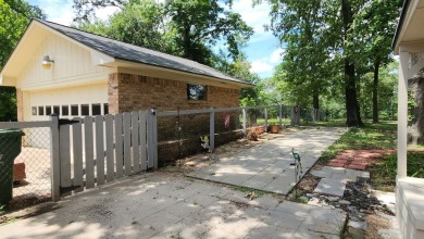 Located on the 9th Fairway and among the trees of the beautiful on Woodland Hills Golf Club in Texas - for sale on GolfHomes.com, golf home, golf lot