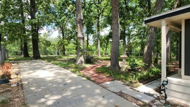 Located on the 9th Fairway and among the trees of the beautiful on Woodland Hills Golf Club in Texas - for sale on GolfHomes.com, golf home, golf lot
