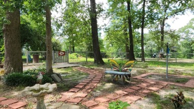 Located on the 9th Fairway and among the trees of the beautiful on Woodland Hills Golf Club in Texas - for sale on GolfHomes.com, golf home, golf lot