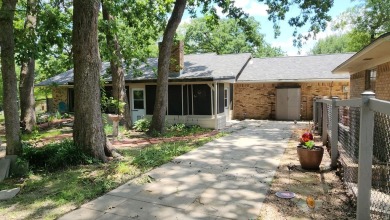 Located on the 9th Fairway and among the trees of the beautiful on Woodland Hills Golf Club in Texas - for sale on GolfHomes.com, golf home, golf lot