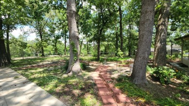 Located on the 9th Fairway and among the trees of the beautiful on Woodland Hills Golf Club in Texas - for sale on GolfHomes.com, golf home, golf lot