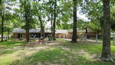 Located on the 9th Fairway and among the trees of the beautiful on Woodland Hills Golf Club in Texas - for sale on GolfHomes.com, golf home, golf lot