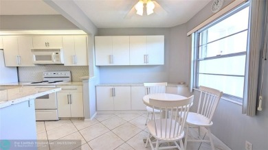 Embrace the vibrant 55+ lifestyle in South Florida's best-kept on Wynmoor Golf Course in Florida - for sale on GolfHomes.com, golf home, golf lot