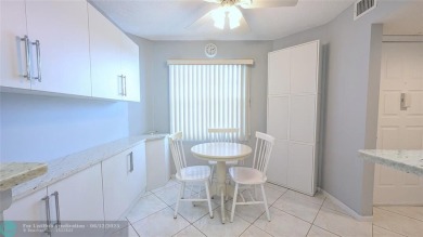 Embrace the vibrant 55+ lifestyle in South Florida's best-kept on Wynmoor Golf Course in Florida - for sale on GolfHomes.com, golf home, golf lot