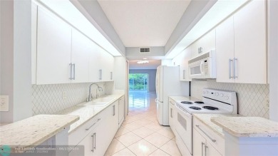 Embrace the vibrant 55+ lifestyle in South Florida's best-kept on Wynmoor Golf Course in Florida - for sale on GolfHomes.com, golf home, golf lot