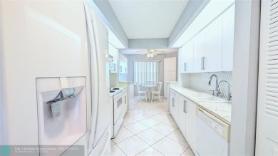 Embrace the vibrant 55+ lifestyle in South Florida's best-kept on Wynmoor Golf Course in Florida - for sale on GolfHomes.com, golf home, golf lot