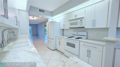 Embrace the vibrant 55+ lifestyle in South Florida's best-kept on Wynmoor Golf Course in Florida - for sale on GolfHomes.com, golf home, golf lot