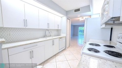 Embrace the vibrant 55+ lifestyle in South Florida's best-kept on Wynmoor Golf Course in Florida - for sale on GolfHomes.com, golf home, golf lot