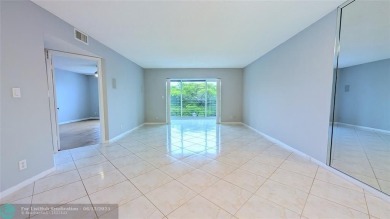 Embrace the vibrant 55+ lifestyle in South Florida's best-kept on Wynmoor Golf Course in Florida - for sale on GolfHomes.com, golf home, golf lot