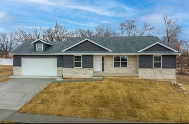 This brand new house completed in Spring 2022 is located in a on Hunters Ridge Golf Course in Iowa - for sale on GolfHomes.com, golf home, golf lot