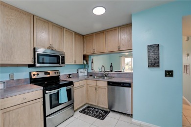 Incredible price reduction! Enjoy this 2 bedroom/2 bath condo on Pelican Pointe 9 Hole Course in Florida - for sale on GolfHomes.com, golf home, golf lot