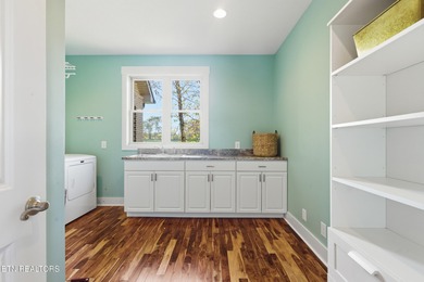 Perched along the 11th fairway of Ruggles Ferry Golf Club, this on Ruggles Ferry Golf Club in Tennessee - for sale on GolfHomes.com, golf home, golf lot