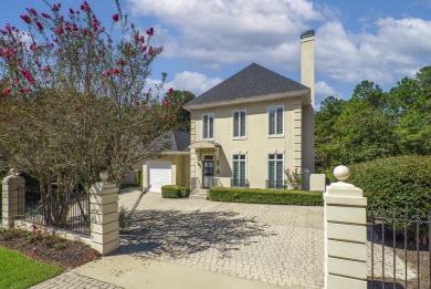 This elegant home with stunning finishes is nestled privately on on Woodside Plantation Country Club in South Carolina - for sale on GolfHomes.com, golf home, golf lot