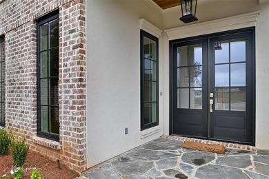 This breathtaking two story home blends modern French country on The Golf Club At StoneBridge in Louisiana - for sale on GolfHomes.com, golf home, golf lot