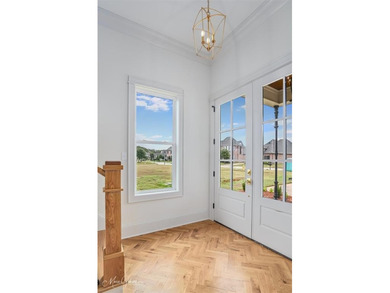 This breathtaking two story home blends modern French country on The Golf Club At StoneBridge in Louisiana - for sale on GolfHomes.com, golf home, golf lot