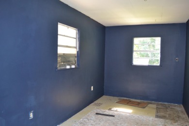 Spacious and full of potential, this 4-bedroom, 2-bathroom home on Jake Gaither Golf Course in Florida - for sale on GolfHomes.com, golf home, golf lot