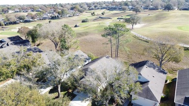 Canterbury model on a sloped golf course lot. that is heading to on Kings Ridge Golf Club in Florida - for sale on GolfHomes.com, golf home, golf lot