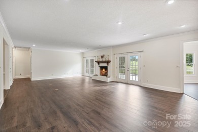 Welcome home to this stunningly remodeled 3BR/2BA residence on Rock Barn Golf and Spa in North Carolina - for sale on GolfHomes.com, golf home, golf lot
