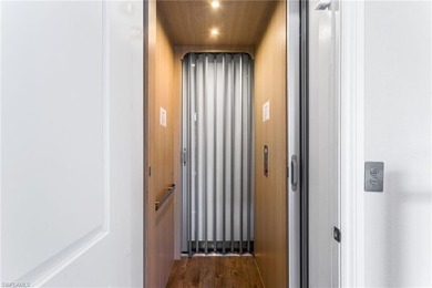 A private elevator and motorized hurricane screens are just a on The Classics Country Club At Lely Resort in Florida - for sale on GolfHomes.com, golf home, golf lot
