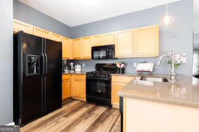 Welcome to this beautifully maintained three-level end-unit on Sugar Hill Golf Club in Georgia - for sale on GolfHomes.com, golf home, golf lot