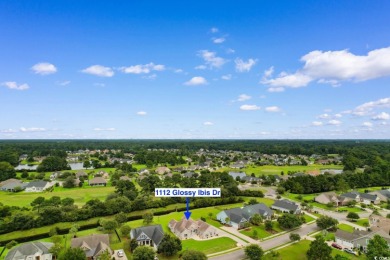 Welcome to this stunning, custom-built home by Jimmy Edwards in on Wild Wing Plantation in South Carolina - for sale on GolfHomes.com, golf home, golf lot