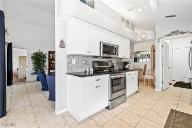 Exceptional Kingston model home with golf course views and on Sabal Springs Golf and Racquet Club in Florida - for sale on GolfHomes.com, golf home, golf lot