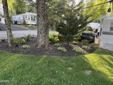Gorgeous RV lot with a beautifully manicured and landscaped yard on Bent Creek Golf Course in Tennessee - for sale on GolfHomes.com, golf home, golf lot