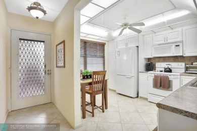WELL CARED FOR 2/2 ON THE GOLF COURSE W/ LOVELY LAKE VIEW! on Wynmoor Golf Course in Florida - for sale on GolfHomes.com, golf home, golf lot