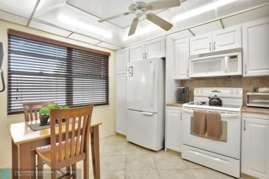 WELL CARED FOR 2/2 ON THE GOLF COURSE W/ LOVELY LAKE VIEW! on Wynmoor Golf Course in Florida - for sale on GolfHomes.com, golf home, golf lot