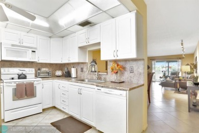 WELL CARED FOR 2/2 ON THE GOLF COURSE W/ LOVELY LAKE VIEW! on Wynmoor Golf Course in Florida - for sale on GolfHomes.com, golf home, golf lot