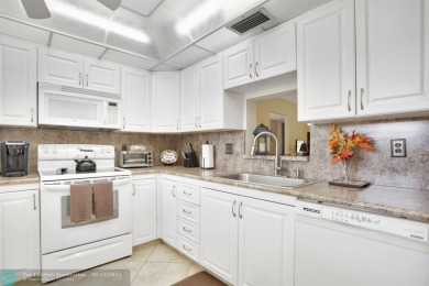 WELL CARED FOR 2/2 ON THE GOLF COURSE W/ LOVELY LAKE VIEW! on Wynmoor Golf Course in Florida - for sale on GolfHomes.com, golf home, golf lot