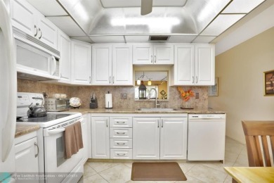 WELL CARED FOR 2/2 ON THE GOLF COURSE W/ LOVELY LAKE VIEW! on Wynmoor Golf Course in Florida - for sale on GolfHomes.com, golf home, golf lot
