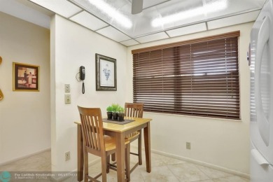 WELL CARED FOR 2/2 ON THE GOLF COURSE W/ LOVELY LAKE VIEW! on Wynmoor Golf Course in Florida - for sale on GolfHomes.com, golf home, golf lot