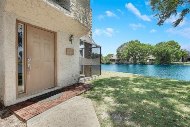 Welcome to your lakeside retreat in the heart of Plantation! on Jacaranda Golf Club in Florida - for sale on GolfHomes.com, golf home, golf lot