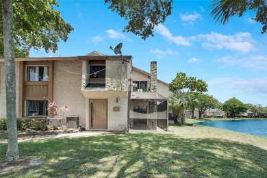 Welcome to your lakeside retreat in the heart of Plantation! on Jacaranda Golf Club in Florida - for sale on GolfHomes.com, golf home, golf lot