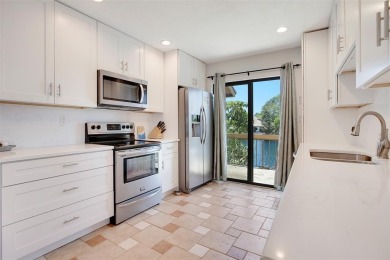Welcome to your lakeside retreat in the heart of Plantation! on Jacaranda Golf Club in Florida - for sale on GolfHomes.com, golf home, golf lot