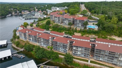 Welcome to your lakeside haven at Palisades Condominiums on Tan-Tar-A Golf Club in Missouri - for sale on GolfHomes.com, golf home, golf lot