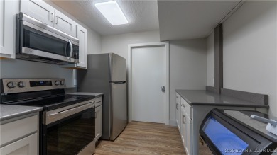 Welcome to your lakeside haven at Palisades Condominiums on Tan-Tar-A Golf Club in Missouri - for sale on GolfHomes.com, golf home, golf lot