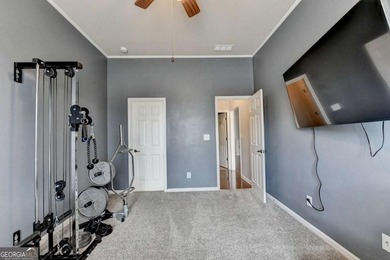 Rarely available primary-on-main floor bedroom plan in highly on Hampton Golf Village in Georgia - for sale on GolfHomes.com, golf home, golf lot