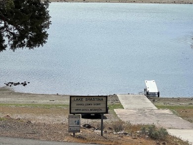 Beautiful Lake Front lot sloping to the lot line near the on Lake Shastina Golf Course in California - for sale on GolfHomes.com, golf home, golf lot