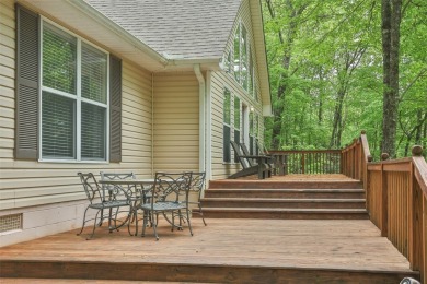 Discover comfort, convenience, and tranquil mountain living at on Sapphire National Golf Club in North Carolina - for sale on GolfHomes.com, golf home, golf lot