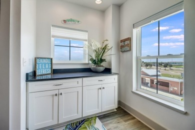 Wowza!! Fly in and enjoy your waterfront 4 story pristine, 3/3.5 on Palmilla Beach Golf Club in Texas - for sale on GolfHomes.com, golf home, golf lot