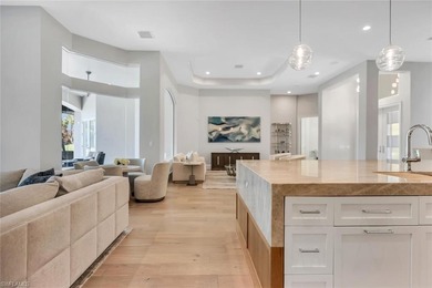 A masterfully renovated Watercrest in Pelican Marsh residence on Pelican Marsh Golf Club in Florida - for sale on GolfHomes.com, golf home, golf lot