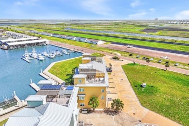 Wowza!! Fly in and enjoy your waterfront 4 story pristine, 3/3.5 on Palmilla Beach Golf Club in Texas - for sale on GolfHomes.com, golf home, golf lot